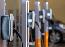 EV charging and electric car, Electric car charging station for charge EV battery, Plug for vehicle with electric engine, EV charger clean energy, Charging point at car parking lot.